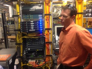 The Giants' Bill Schlough in front of some hard-working wireless network hardware. Credit: John Britton, AT&T.
