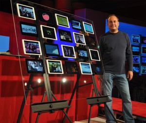 Artemis Networks CEO Steve Perlman shows off a "wall" of iPads, all simultaneously running video off one 5 MHz LTE channel via an Artemis pCell network. Credit: Artemis Networks.