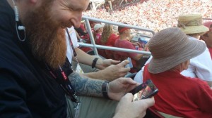 Niners VP of technology Dan Williams attempts to fix my Droid 4 Wi-Fi issues (while trying not to laugh at the fact that I actually have and use a Droid 4) during the first preseason game at Levi's Stadium, July 2014
