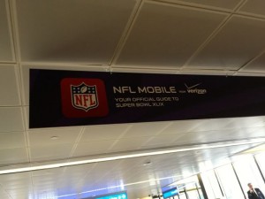 Verizon's NFL Mobile ads were in airport walkways well before the Big Game