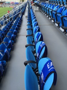 Seats with promo scarves. The team asked fans to donate if they wanted to keep the scarves.