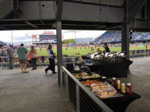 Where the rich folks watch from: Over the gate view of a club level area and their nice buffet