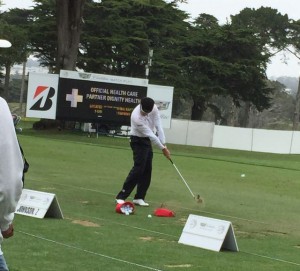 Zach Johnson dials in short irons on the range.