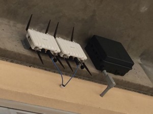 EchoBOT enclosures (white) next to a Wi-FI AP