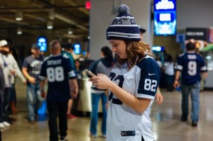 Dallas fan in mobile action at AT&T Stadium. Photo: Phil Harvey, MSR