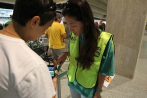 A Baylor "Wi-Fi Coach" helps a fan negotiate the network. Credit: Baylor University