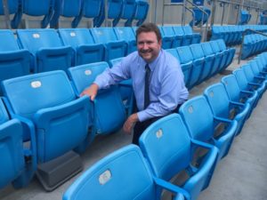 James Hammond, director  of IT for the Panthers, poses next to an under-seat Wi-Fi AP. Credit all photos: Carolina Panthers